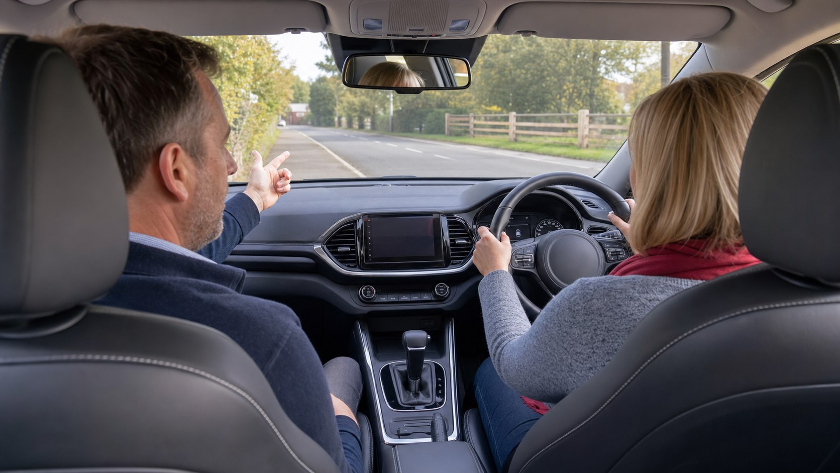Driving instructor calmly coaching a driver during a one-to-one automatic confidence lesson